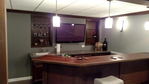 Media living room with fireplace wall