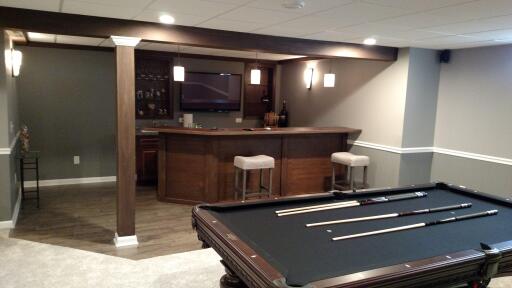 Entertainment room with custom bar and pool table