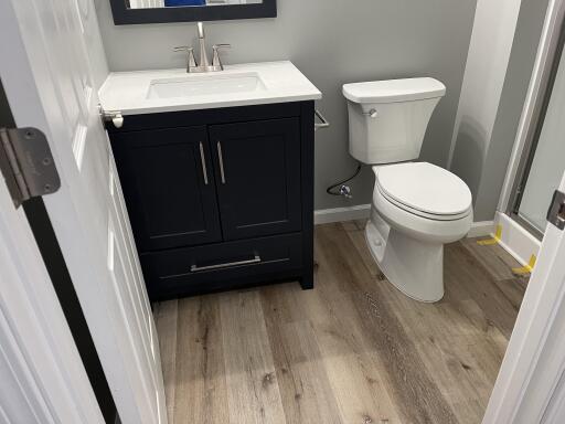 Basement Bathroom with Vanity & Toilet