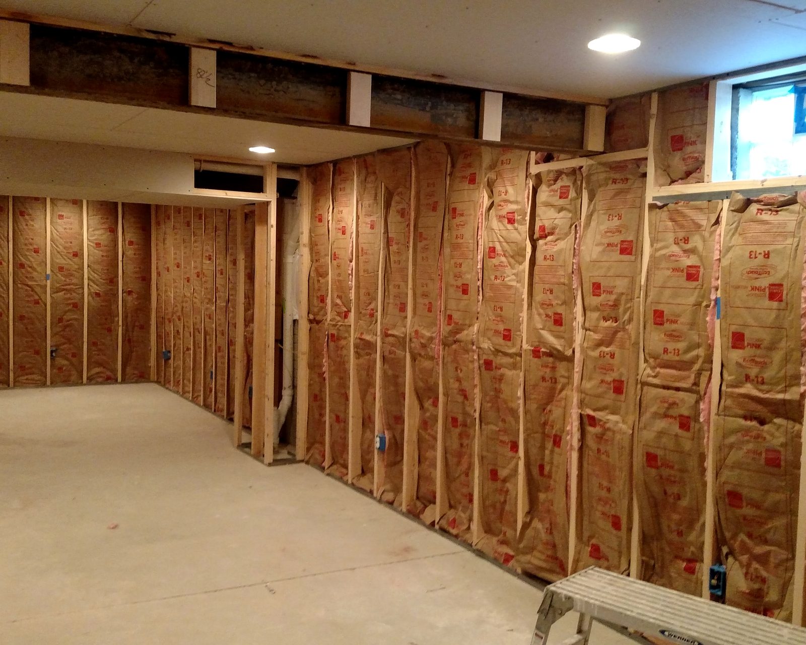 Fiberglass insulation and framing on site